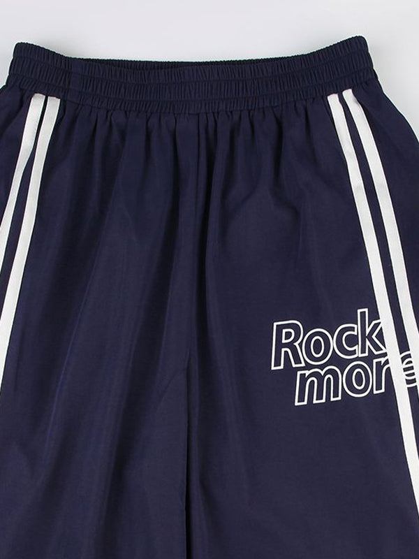 Pantalon streetwear bleu marine des années 90 à rayures et jambes larges