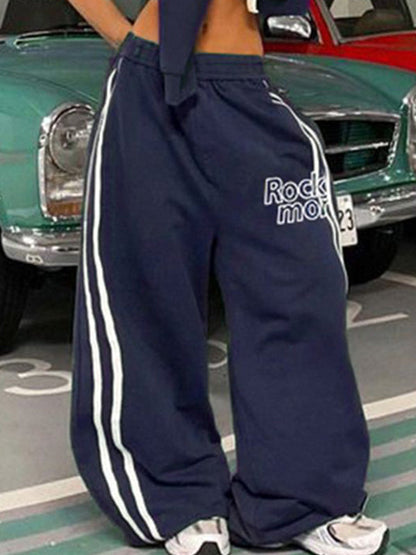 Pantalon streetwear bleu marine des années 90 à rayures et jambes larges