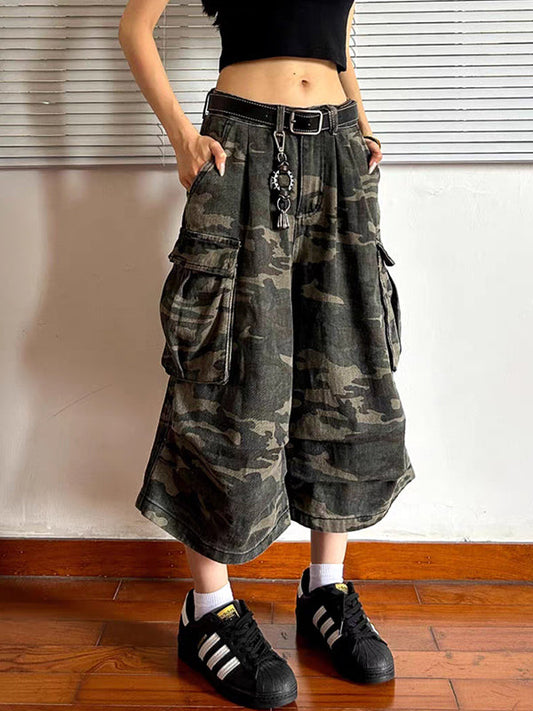 Green vintage shorts made of aged denim in scimitar style