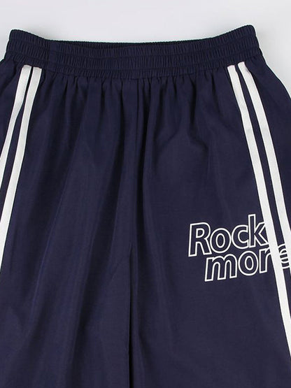 Pantalon streetwear bleu marine des années 90 à rayures et jambes larges