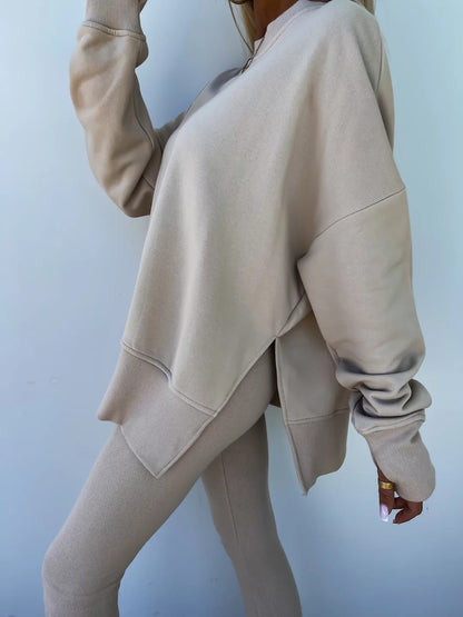Loose long-sleeved round neck slit top and tight pants two-piece set