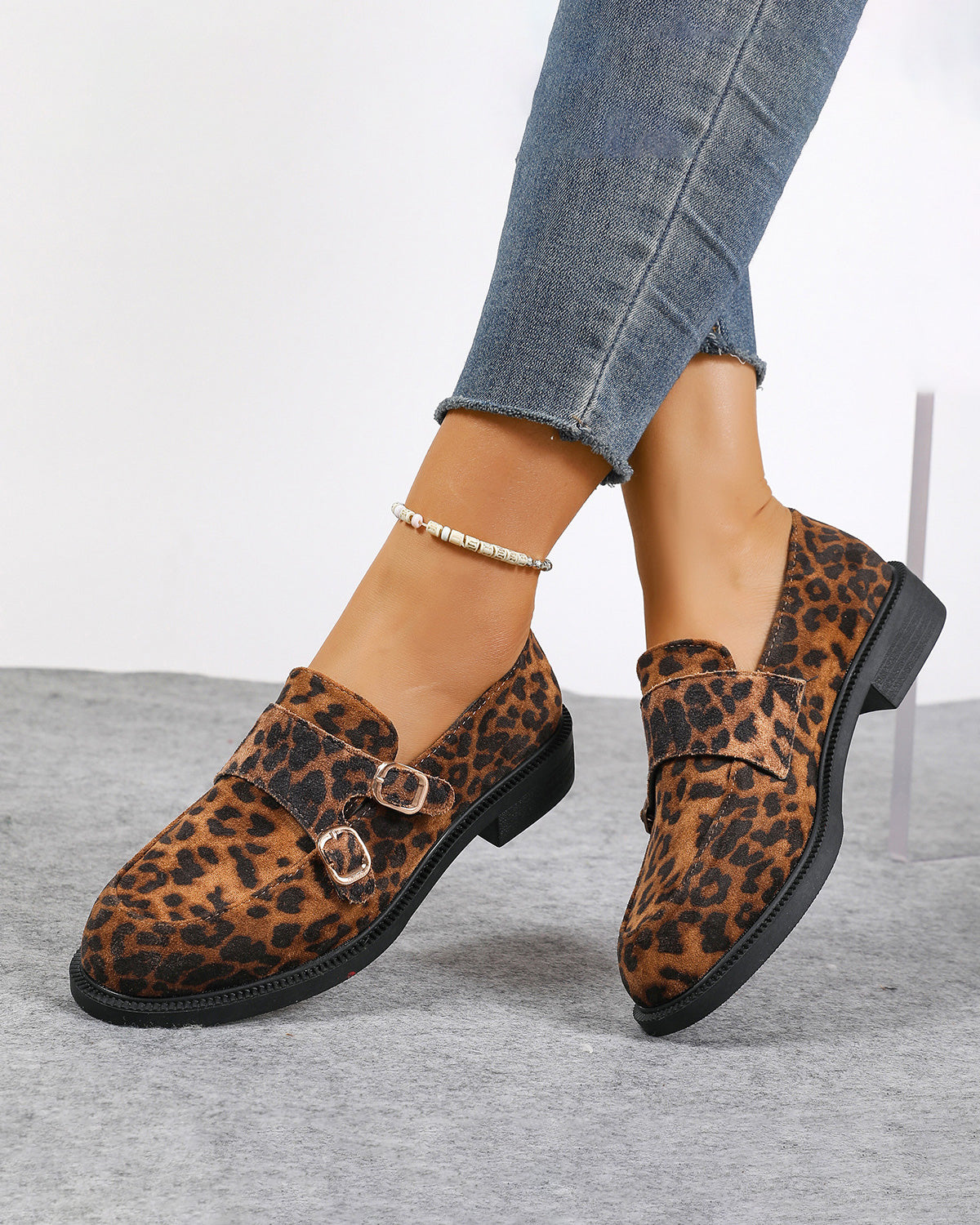 Buckled low-heeled British-style leopard-print loafers