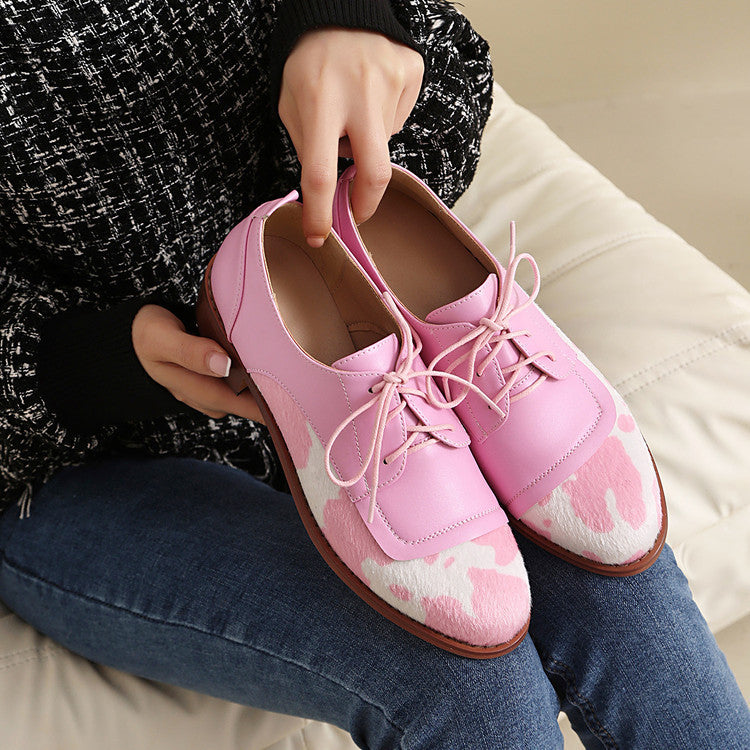 Round toe low-cut suede-trimmed cow-print loafers