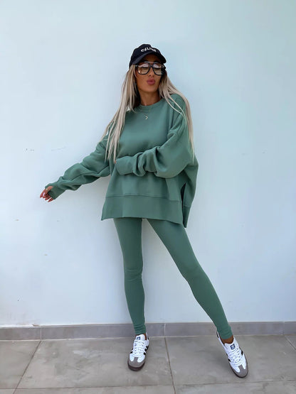 Loose long-sleeved round neck slit top and tight pants two-piece set