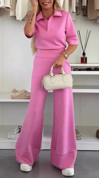 Zweiteiliger Anzug aus einfarbigem, kurzärmeligem Reversoberteil und hoch taillierter Hose mit weitem Bein