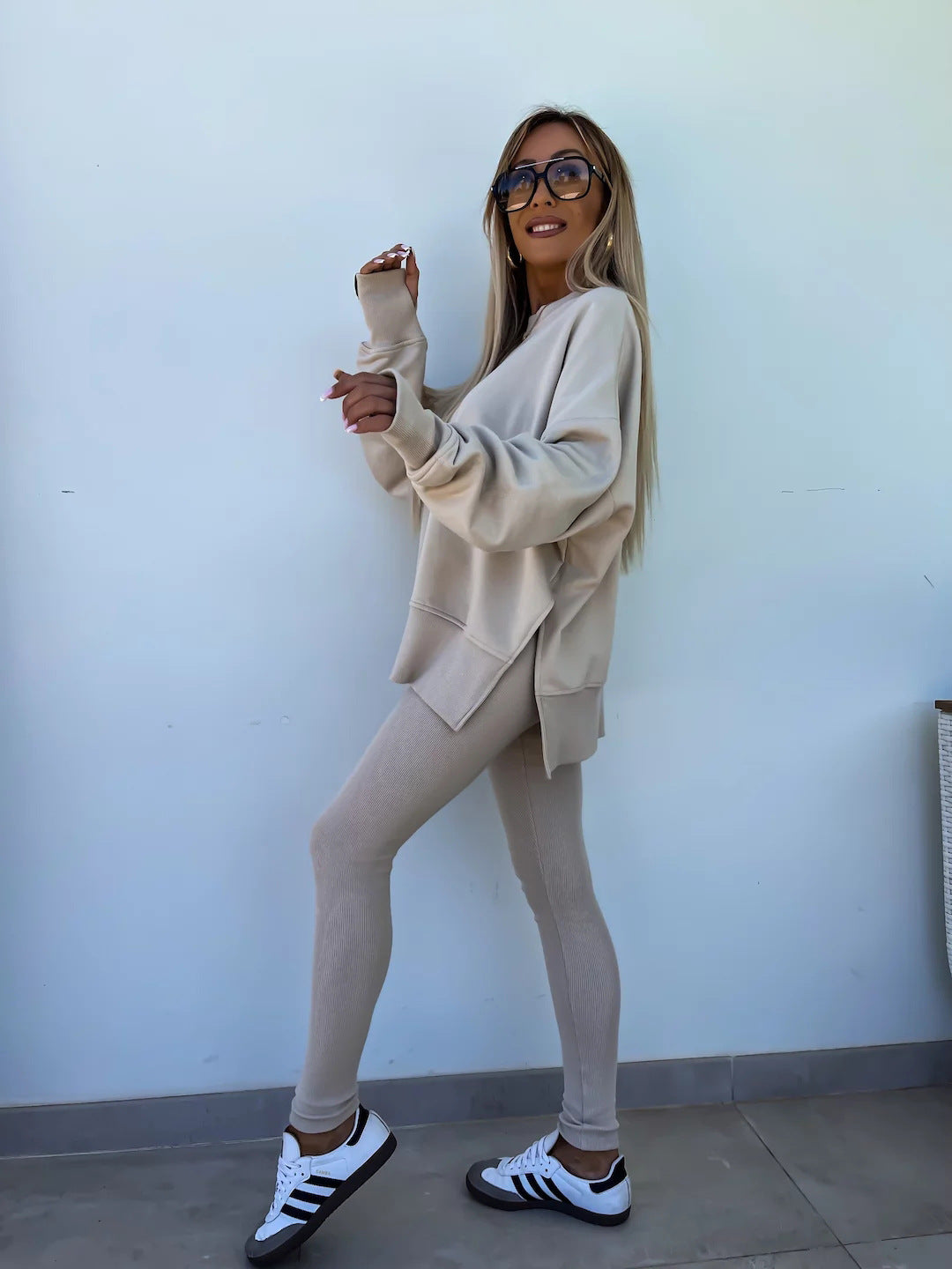 Loose long-sleeved round neck slit top and tight pants two-piece set