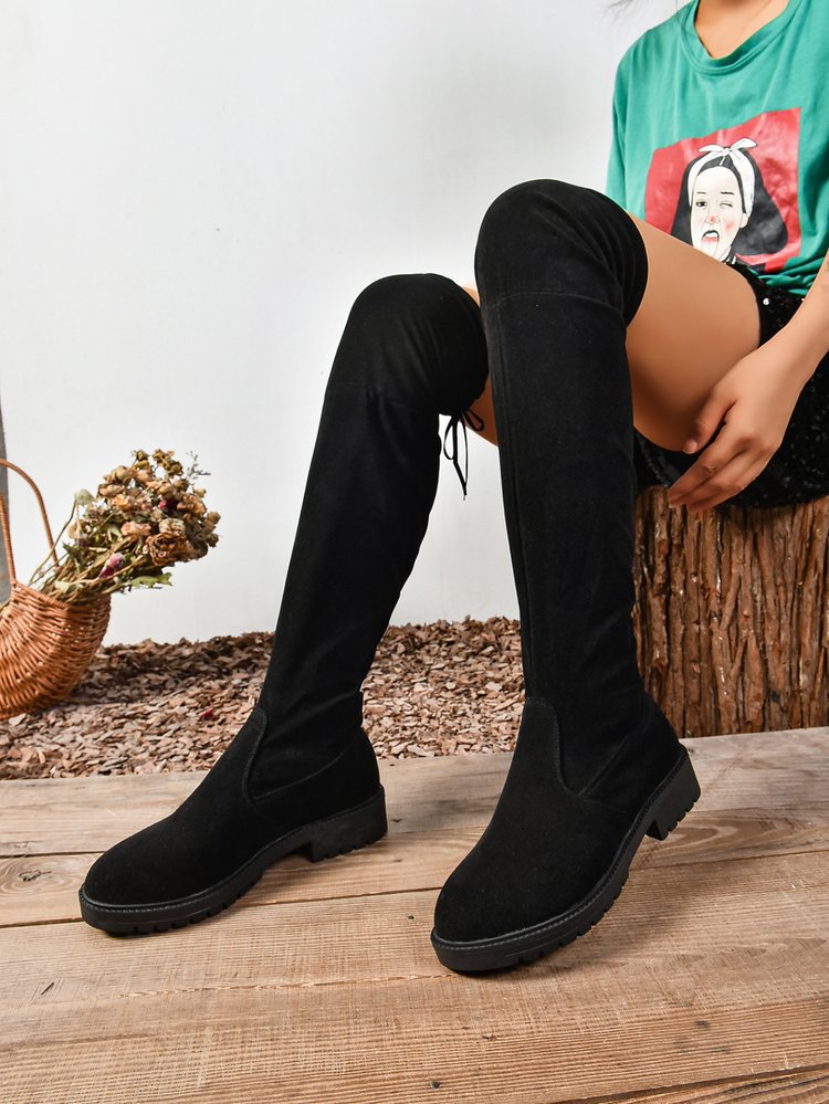 Black elastic flat over-the-knee boots