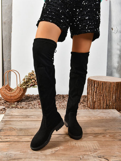 Black elastic flat over-the-knee boots