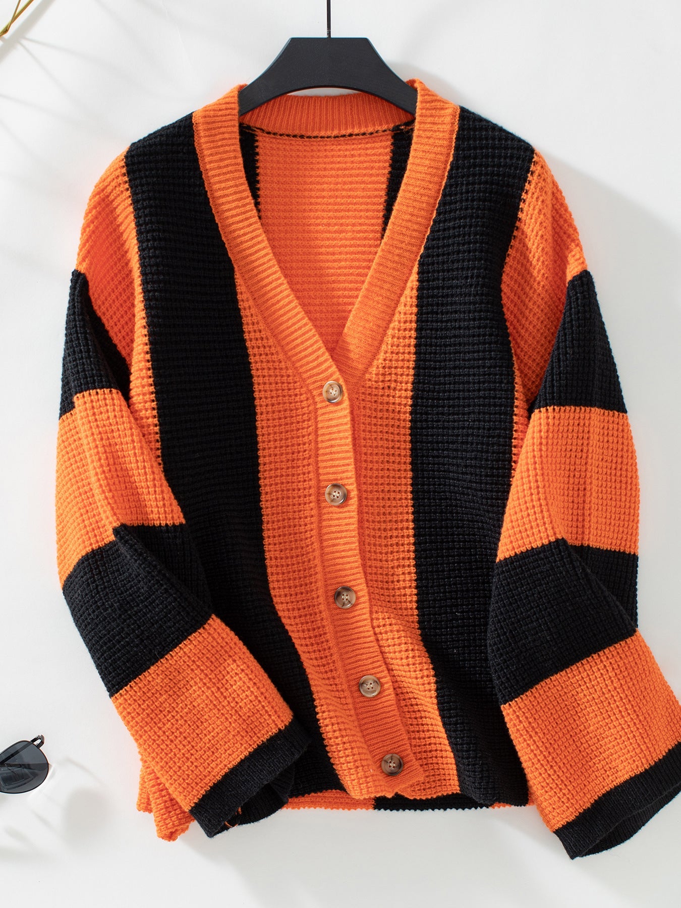 Loose vertical striped button-down knitted cardigan