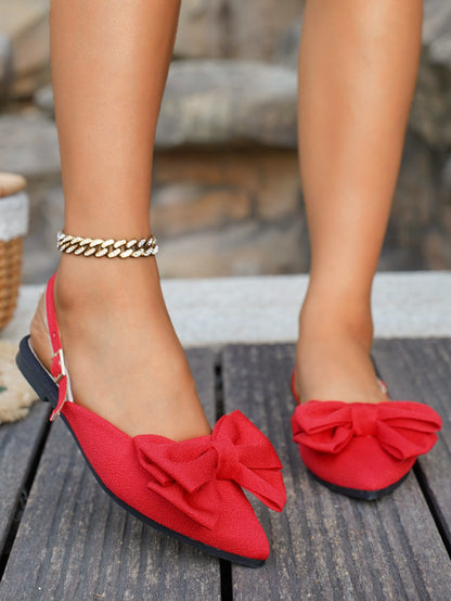 Large bow pointed toe flat heel sandals
