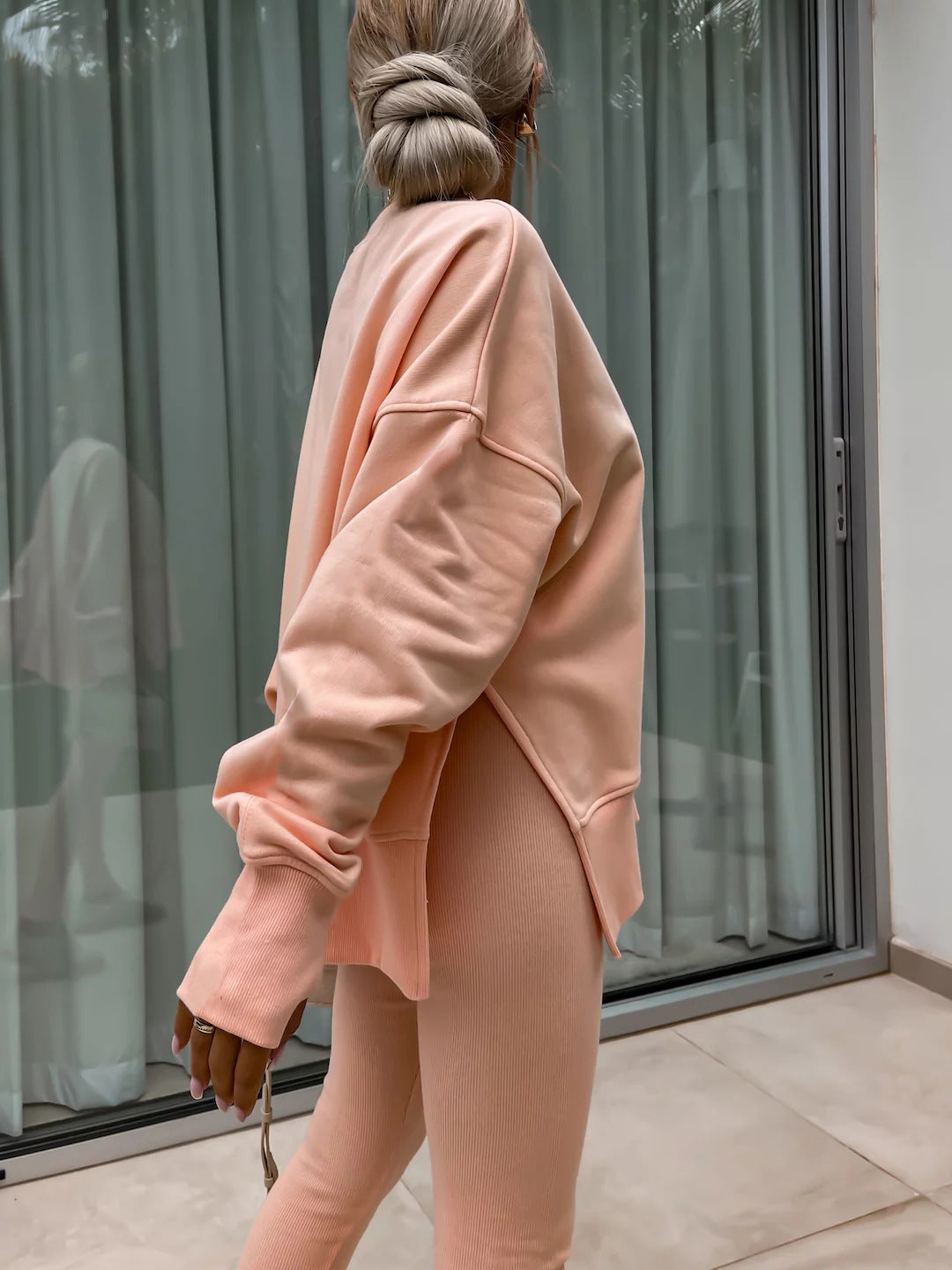 Loose long-sleeved round neck slit top and tight pants two-piece set