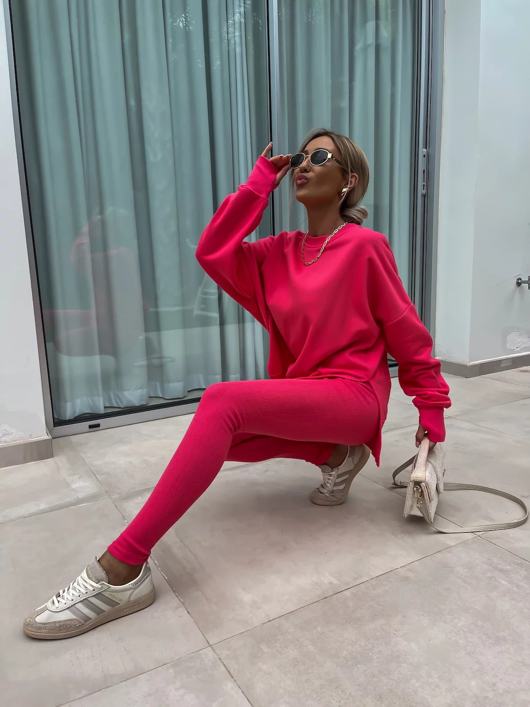 Loose long-sleeved round neck slit top and tight pants two-piece set