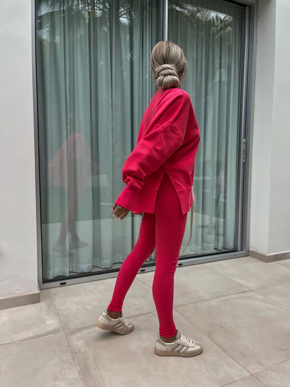 Loose long-sleeved round neck slit top and tight pants two-piece set