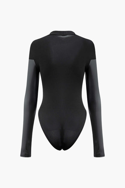 Schwarzer Mock Neck Bodysuit mit Kunstleder Paneln und Langen Ärmeln