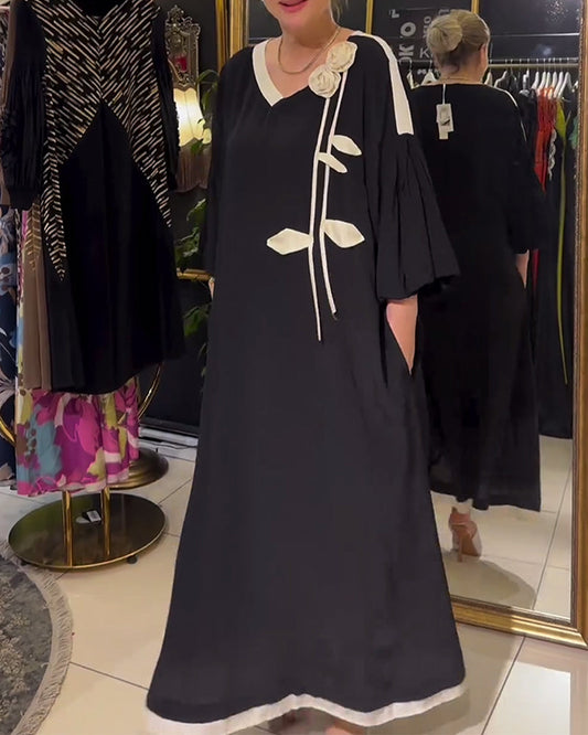 Modisches, lockeres kleid mit dreidimensionalem blumenmuster in kontrastfarbe